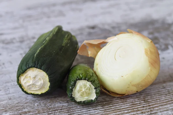 Expired vegetables over a wooden table