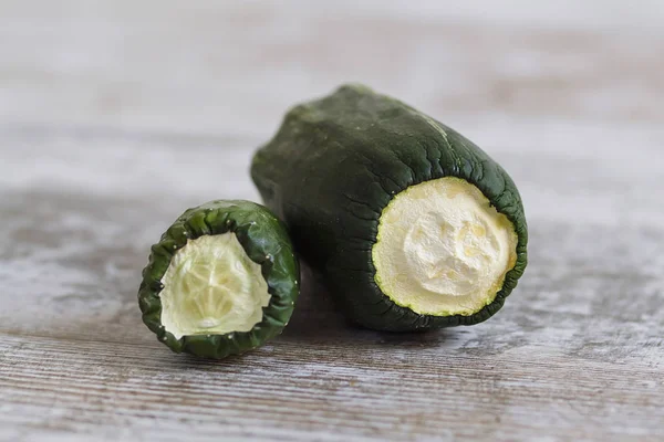 Expired vegetables over a wooden table