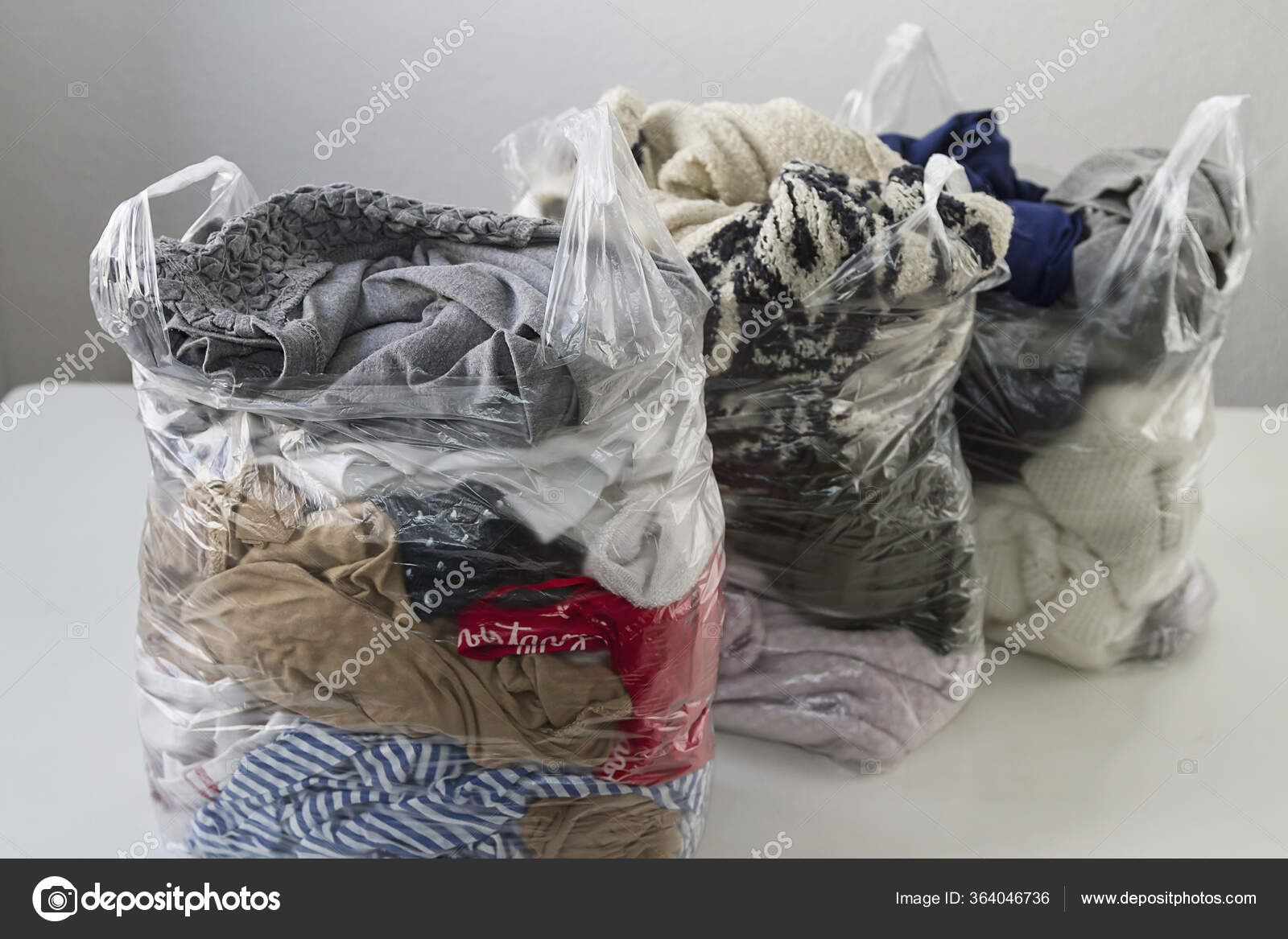 Everyday Clothes Packed Plastic Bags Stock Photo Ondacaracola everyday-clothes-packed-plastic-bags-stock-photo-ondacaracola