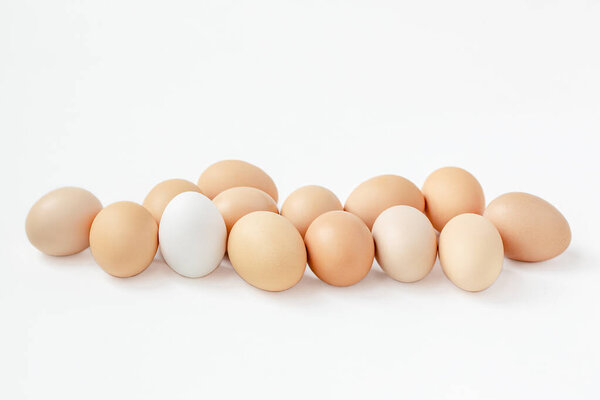 A group of brown eggs white background. Getting ready for the Easter holiday.