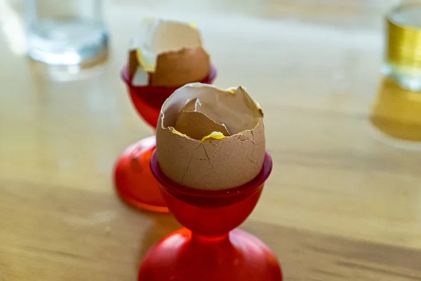 Empty egg shell in egg cup red