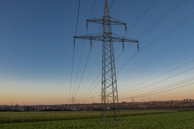 Power pole in the landscape with blue sky