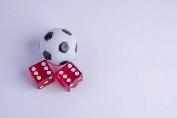 Football with red dice for gambling