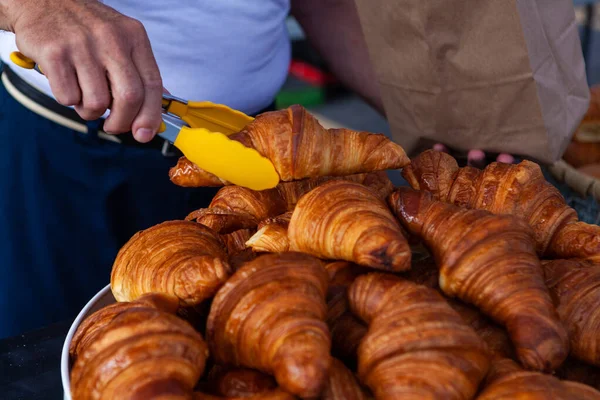 Selling croissants at the farmers market