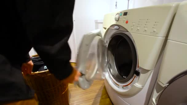 Man doing laundry. — Stock Video