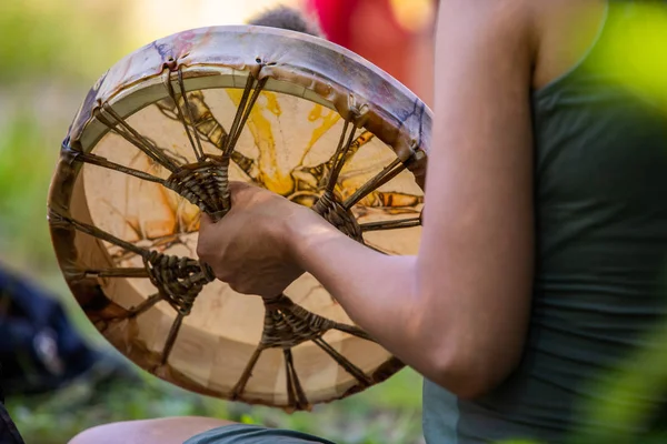 Closeup on man playing on sacred drum — Stock Photo, Image