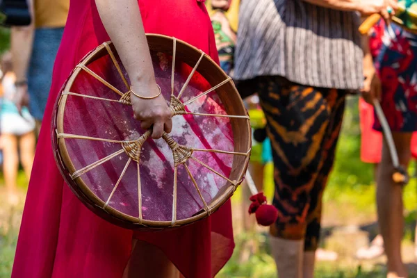 Closeup of woman holding sacred drum — ストック写真