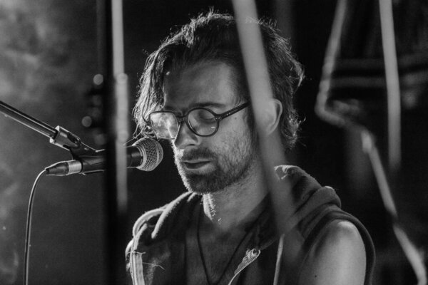 a male singer performing on stage