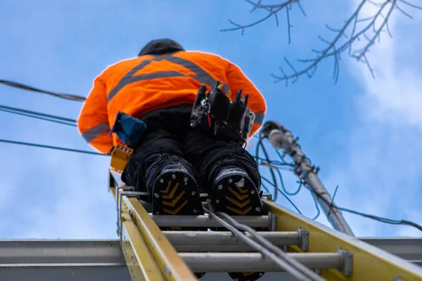 Telecommunications technician at work