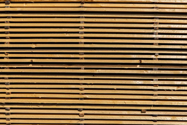 Wood planks stacked in sawmill yard — Stock Photo, Image