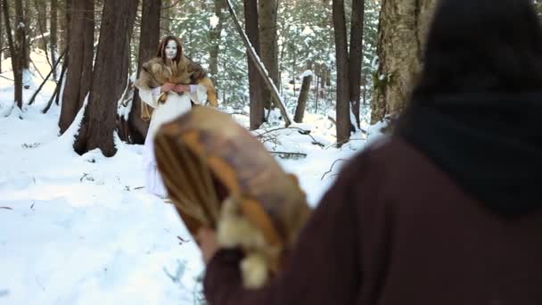 Mystical shaman healer in winter forest — Stock Video