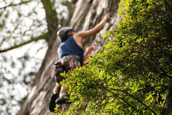 Traditional outdoor rock climber ascends — 스톡 사진