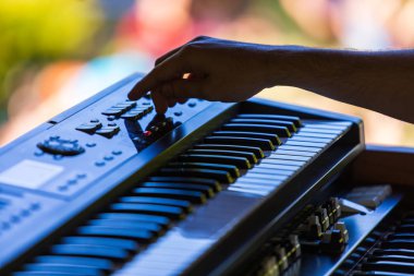 Hands of an electronic keyboard player clipart