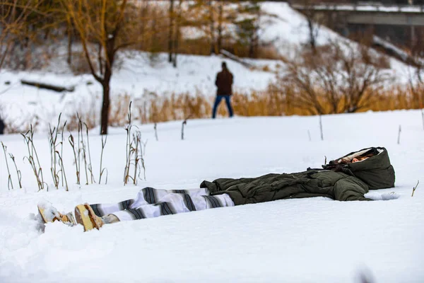 A tired woman lying on the snow — Stock Photo, Image