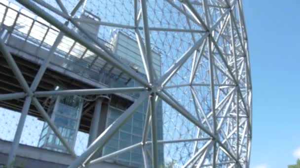 Geodesic dome under a clear and cloudy sky — Stock Video