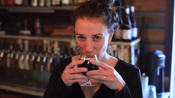 Woman drinking red wine in brewery pub — Stock Video