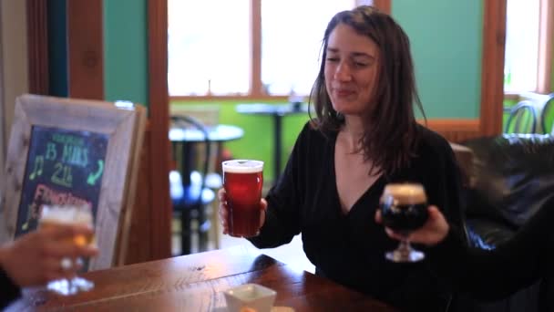 Woman clinking wine glass and taking a sip — Stock Video