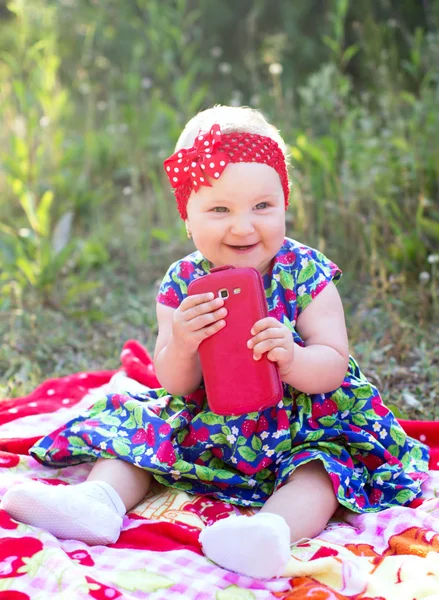 Happy child playing with the phone — Stock Photo, Image