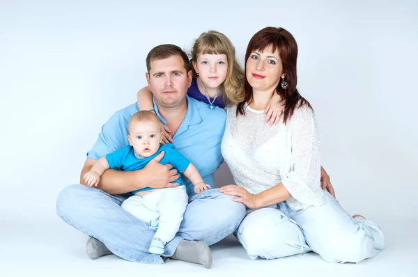 Happy young family with young children — Stock Photo, Image