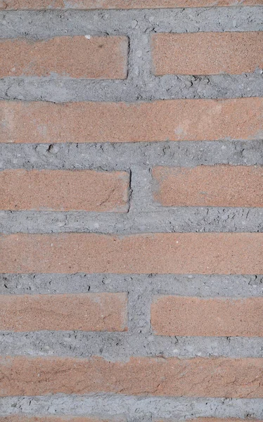 Een Stenen Muur Rood Met Grijs Cement Verticaal Georiënteerd — Stockfoto