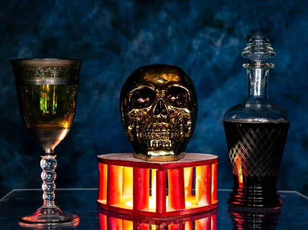 voodoo ritual with skull and magic potion in the glass glowing