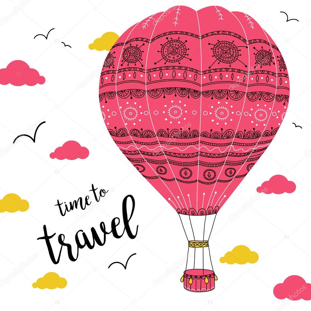 hot air balloon with ornaments in cloudy sky