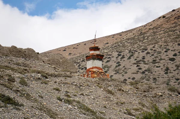 Buddhist Chorten for protection from evil spirits stand on a hill. Trekking to the Upper Mustang. Nepal.