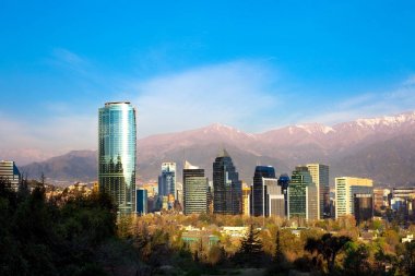 Skyline of Modern buildings in Santiago de Chile with The Andes Mountain Range in the back clipart