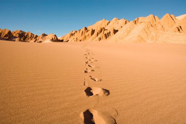 Footprints at Valle de la Muerte (spanish for Death Valley) also known as La Cordillera de la Sal (spanish for salt mountain range), San Pedro de Atacama, Atacama Desert, Antofagasta Region, Chile, South America clipart