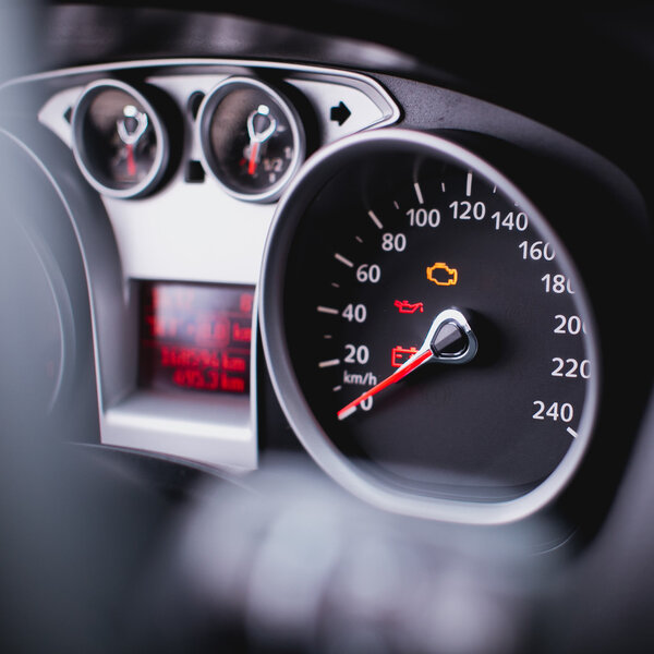 Close up shot of a speedometer in a car