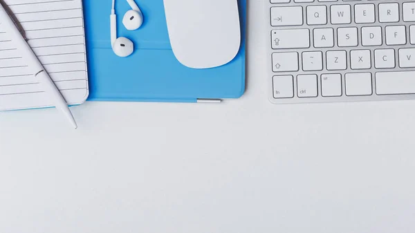 Top view of keyboard, headphones, mouse, notepad, on white background isolated.