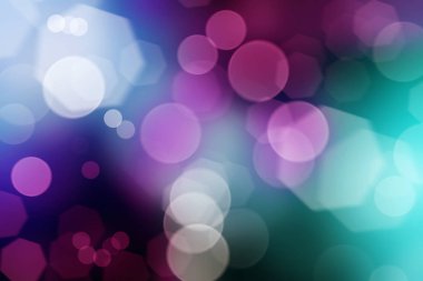 Bulanık bokeh daireleri ve ışıkları olan soyut mor arkaplan dokusu.