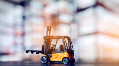 Forklift loader close up. Pallet stacker truck equipment at warehouse.