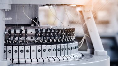 Textile Manufacturing. Circular knitted fabric. Textile factory in spinning production line and a rotating machinery and equipment production company. Clothing industry. Manufacturing textile fabrics.