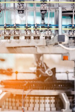 Textile Manufacturing. Circular knitted fabric. Textile factory in spinning production line and a rotating machinery and equipment production company. Clothing industry. Manufacturing textile fabrics.