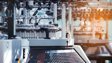Textile Manufacturing. Circular knitted fabric. Textile factory in spinning production line and a rotating machinery and equipment production company. Clothing industry. Manufacturing textile fabrics.