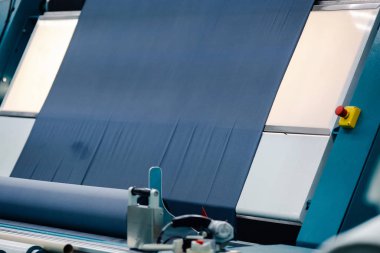 Textile Manufacturing. Circular knitted fabric. Textile factory in spinning production line and a rotating machinery and equipment production company. Clothing industry. Manufacturing textile fabrics.