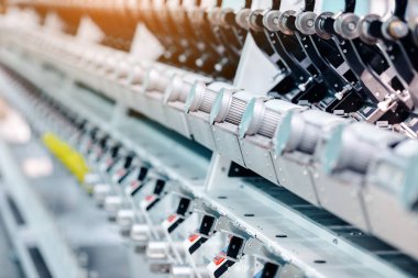 Textile Manufacturing. Circular knitted fabric. Textile factory in spinning production line and a rotating machinery and equipment production company. Clothing industry. Manufacturing textile fabrics.