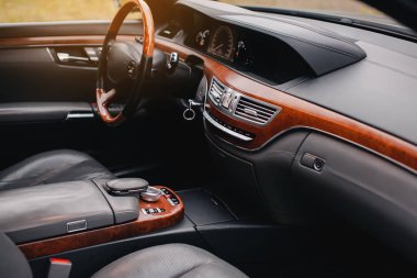 Luxury premium car interior with leather seats and modern technology.