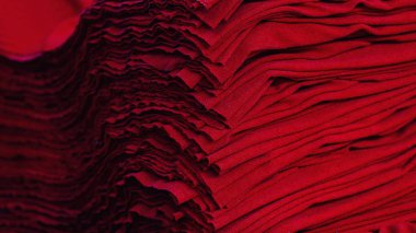 Material on the textile factory. Red cloth clothing texture material textile pattern background.