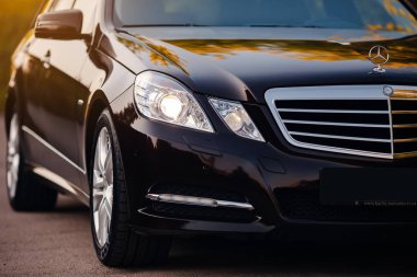 Stuttgart, Germany - January 28, 2020: Original Mercedes E-class W212 Touring Wagon, avantgarde, Mercedes logo, front light.