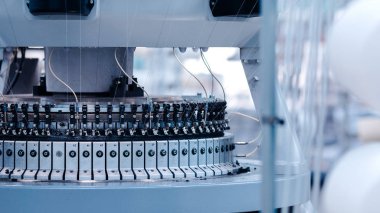 Textile Manufacturing. Circular knitted fabric. Textile factory in spinning production line and a rotating machinery and equipment production company. Clothing industry. Manufacturing textile fabrics.