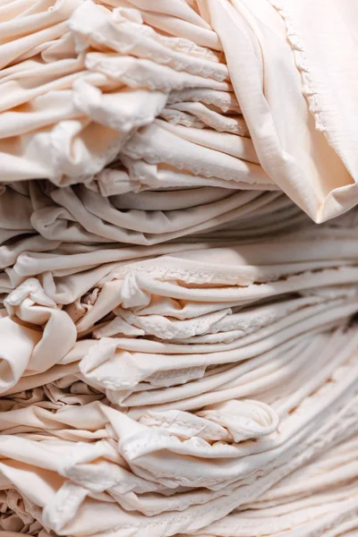 Material on the textile factory. Cloth clothing texture material textile pattern background.