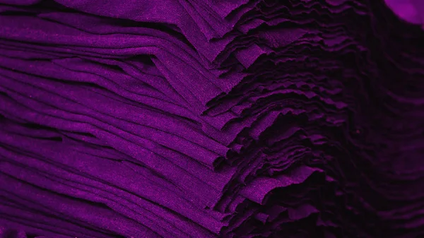 Material on the textile factory. Violet cloth clothing texture material textile pattern background.