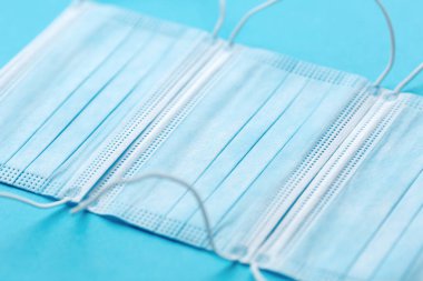 Medical mask, Medical protective masks on blue background. Disposable surgical face mask cover the mouth and nose. Healthcare and medical concept.
