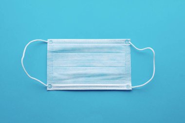 Medical mask, Medical protective masks on blue background. Disposable surgical face mask cover the mouth and nose. Healthcare and medical concept.