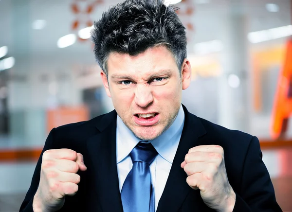 Businessman Clenching Fists To Motivate Team In Office — Stock Photo, Image