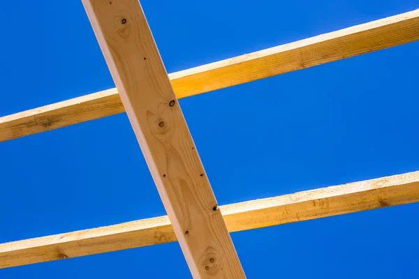 Residential construction home framing against a blue sky Royalty Free Stock Photos