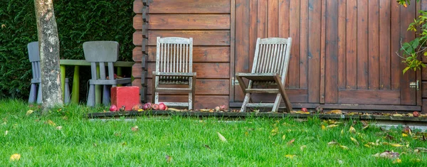 Wooden garden tool shed in a beautiful park