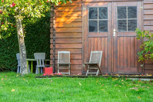 Wooden garden tool shed in a beautiful park